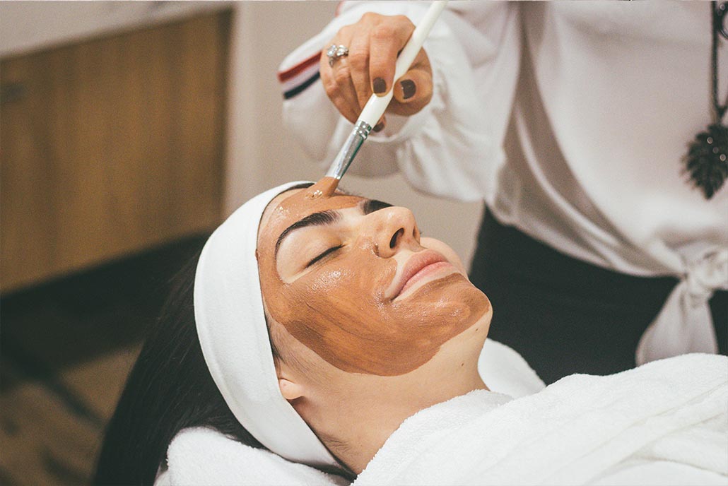 girl getting facial at home to relax and de-stress