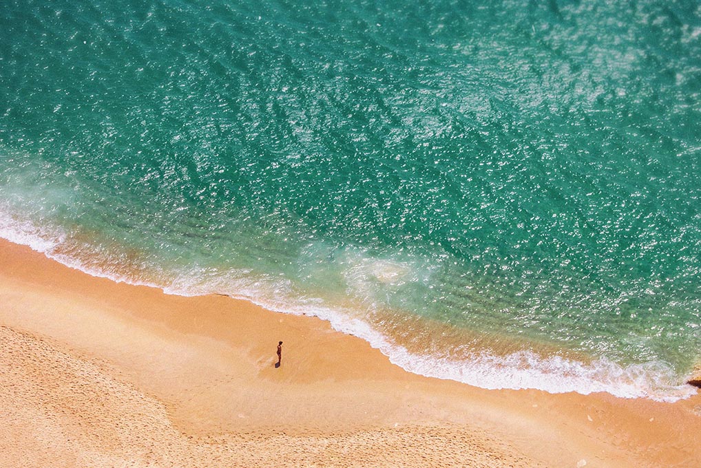 person on the beach wearing sunscreen